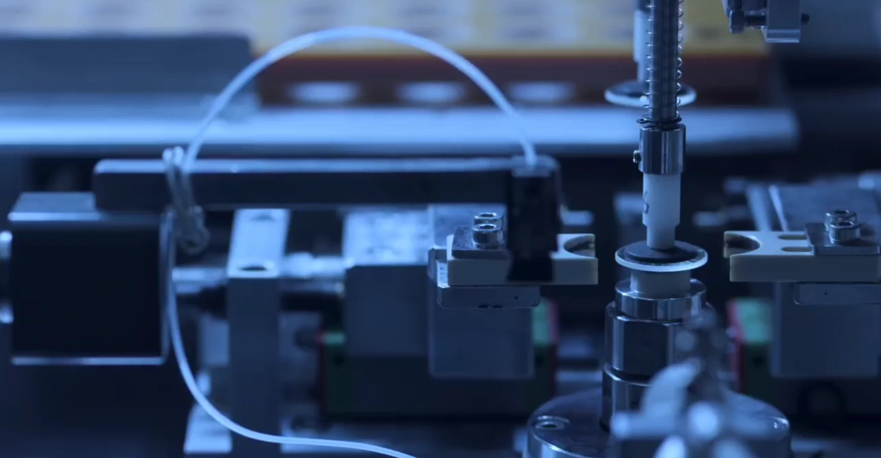 Optical component processing equipment at a PHOSLENS manufacturing partner